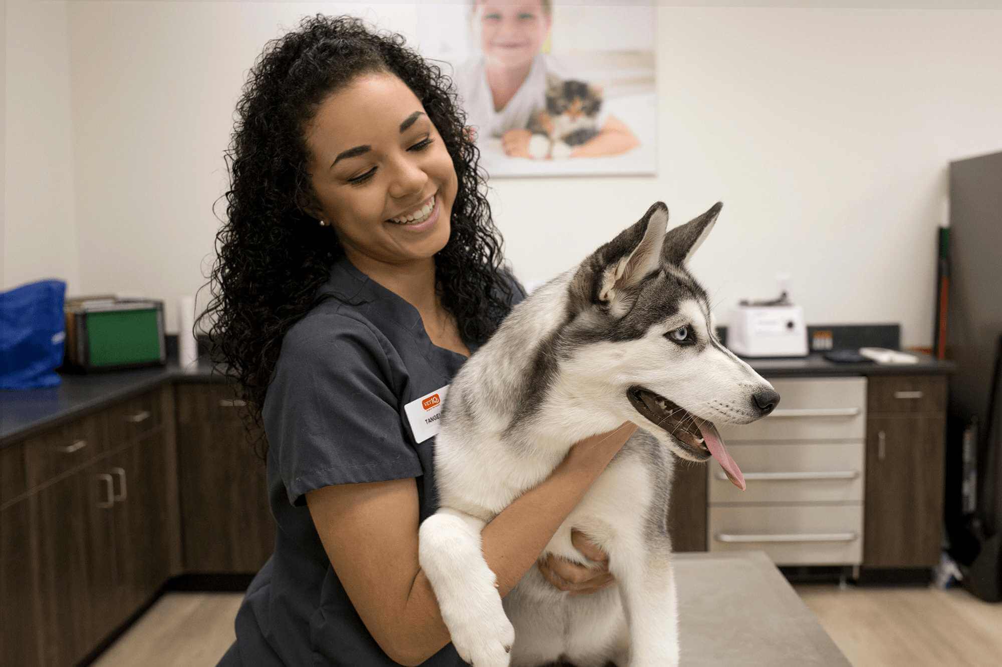 woman holding dog